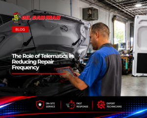 Fleet maintenance technician using a diagnostic tablet to inspect a commercial service van engine inside a professional repair facility, with mobile fleet service vehicles and workshop equipment visible in the background.