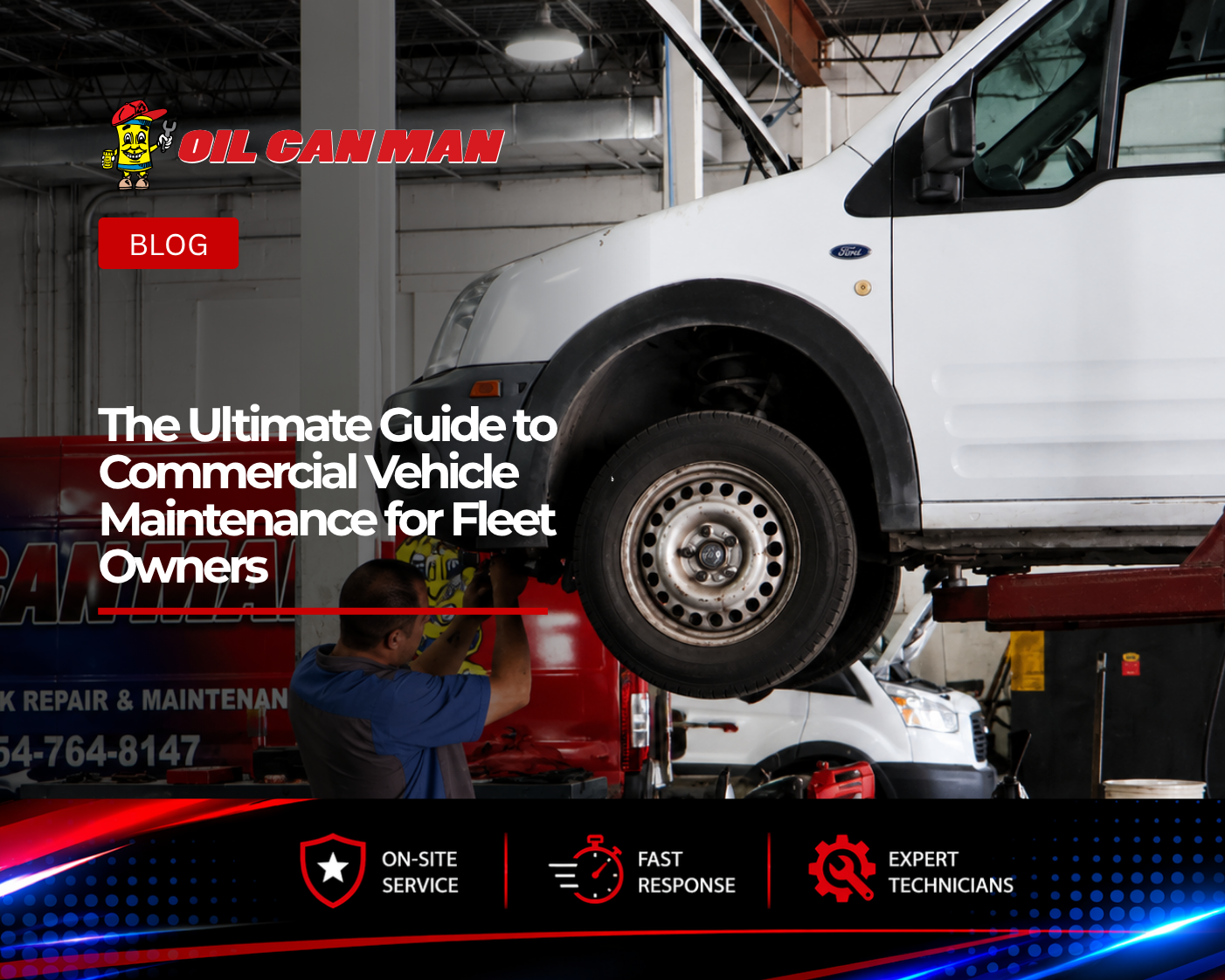 Technician performing maintenance under a raised white Ford Transit service van inside a professional commercial fleet repair shop, with mobile truck repair vehicles and service equipment visible in the background.