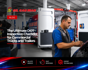 Oil Can Man technician performing a DOT inspection on a commercial truck in a fleet service yard with branded mobile repair van in the background.